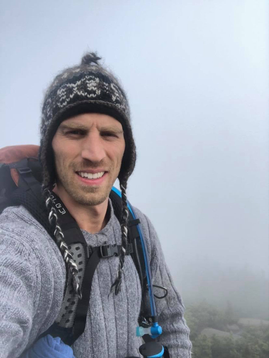 Jason Kaplowitz outdoors on a mountain hike